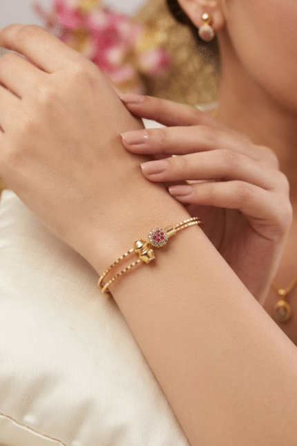 Golden Double-Line Bracelet with Stone Studded Floral Charm
Trendy Kada Bangle for Women & Girls | Ethnic & Modern Fashion Accessory